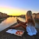 couples coordinates how to visit italy on a budget alex pizza and wine picnic on the arno