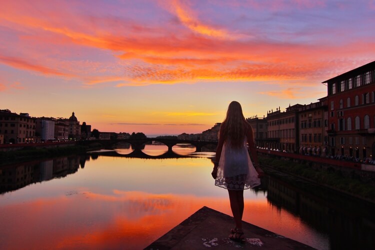 couples coordinates sunset over arno river florence guide italy